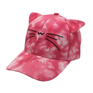Close-up of pink tie-dye baseball cap featuring 3D cat ears and whiskers embroidery