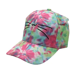 Detailed close-up of colorful tie-dye kids baseball cap with 3D cat ears and embroidery