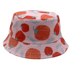 Macro detail of kids bucket hat featuring cartoon pumpkin prints and reinforced stitching