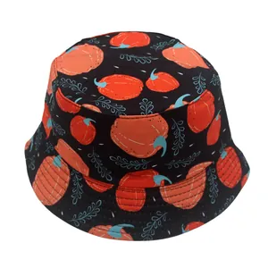 Close-up of black bucket hat with orange pumpkin prints and detailed brim stitching