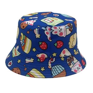 Detailed view of dark blue bucket hat with cartoon bears and colorful cake prints