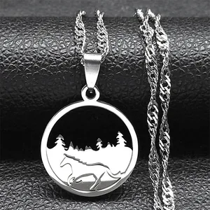 Detail of silver stainless steel necklace with laser cut horse and forest pendant