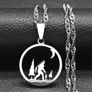 Detailed view of silver Bigfoot pendant with moon and forest silhouette on rope chain