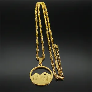 Detail of multi-layered mountain silhouette pendant on a twisted rope chain necklace