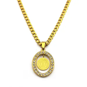Saint Benedict religious pendant with iced-out oval frame and gold Cuban link chain