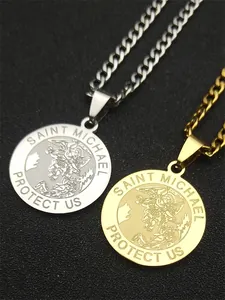 Macro view of Saint Michael stainless steel pendants in silver and gold with Cuban chains