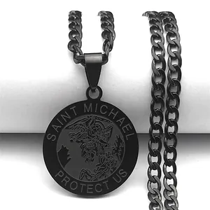 Close-up of black stainless steel St. Michael pendant with curb chain and engraving