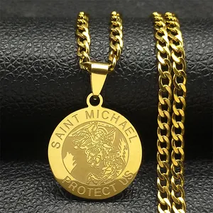 Macro shot of gold Saint Michael pendant with Cuban link chain on black leather