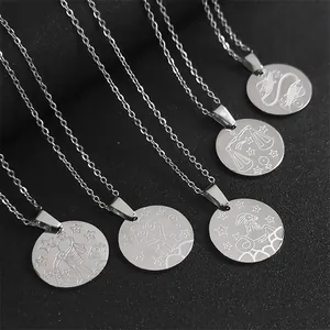 Macro shot of silver stainless steel zodiac coin pendants with intricate relief engravings