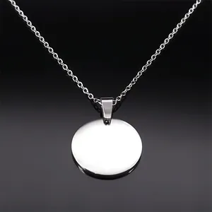 Detailed macro view of high-polished silver round pendant with elegant O-chain