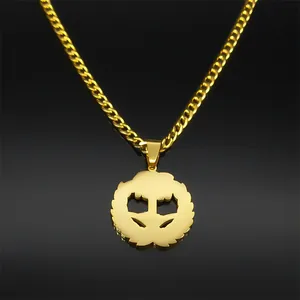 Detail of gold-plated stainless steel necklace with geometric circular pendant