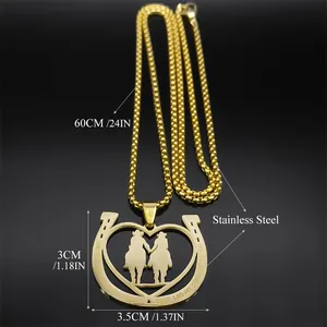 Golden stainless steel necklace featuring a horseshoe and couple silhouette pendant