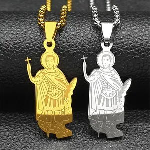Macro detail of gold and silver religious saint pendants with etched design on leather
