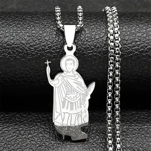 Macro shot of silver gothic pendant featuring detailed religious figure on black leather