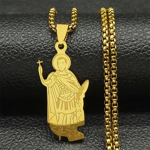 Macro shot of gold saint pendant with cross and shield on black leather stand