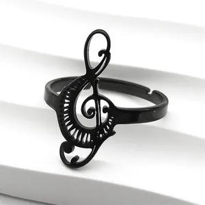 Macro detail of a black treble clef music note ring with adjustable open band design