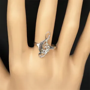 Silver treble clef musical note open ring with adjustable minimalist metal design