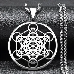 Macro detail of silver Metatron cube pendant with thick box chain on black leather