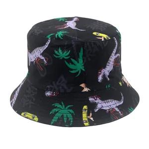 Close-up of black bucket hat featuring colorful cartoon dinosaur and palm tree prints