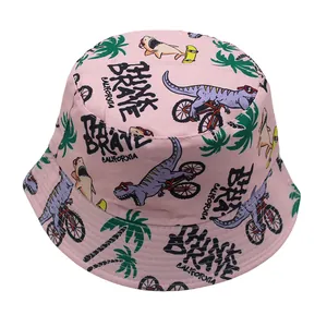 Detail of pink canvas bucket hat with dinosaur print and Brave California text