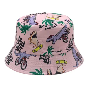 Detailed view of pink kids bucket hat with cartoon dinosaur and surfboard patterns