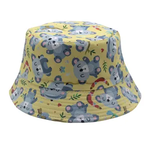 Kids reversible bucket hat with yellow canvas and cute blue koala cartoon prints