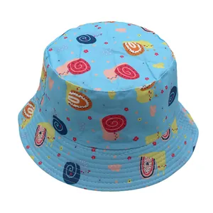 Detail of baby sun hat with cute cartoon snail print on sky blue fabric with reinforced stitching