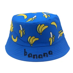 Royal blue kids bucket hat with yellow banana print and banana text branding