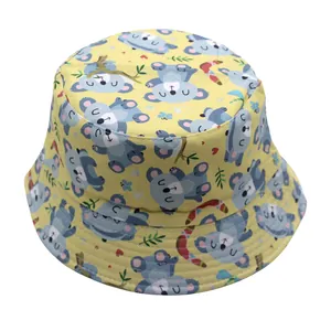Detail view of cotton sun hat for children with yellow fabric and cute koala prints