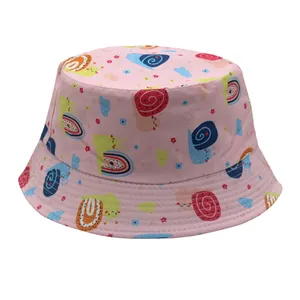 Detailed close-up of light pink kids bucket hat with colorful snail and cloud patterns