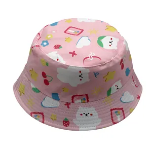Close-up of pink cotton bucket hat featuring cute cartoon bear and floral patterns
