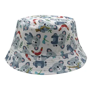 Reversible kids bucket hat with cute cartoon koala and dragonfly print on white fabric