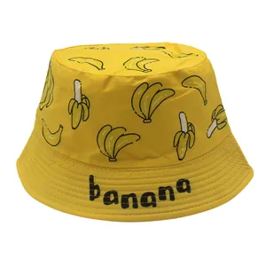 Yellow kids bucket hat with banana print and banana text for sun protection