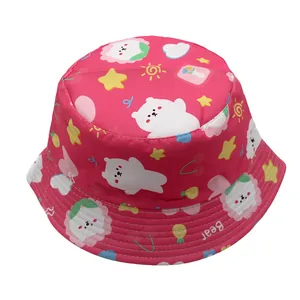 Close-up of pink bucket hat featuring cute cartoon bear prints and white stitched brim