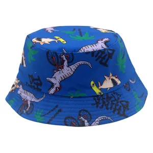 Close-up of blue kids bucket hat featuring cartoon dinosaur and shark prints