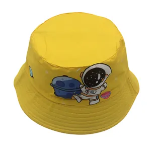 Close-up of vibrant yellow cotton kids bucket hat with cartoon astronaut pattern