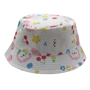 Close-up of cute cartoon cherry and lion prints on white cotton sun bucket hat for kids
