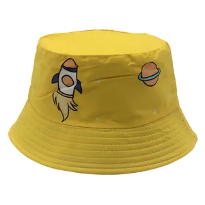 Close-up of kids' yellow bucket hat with cartoon rocket and planet print details