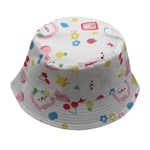 Close-up of white bucket hat with colorful lion, star and cherry cartoon prints