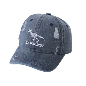Kids navy dinosaur baseball cap featuring white skeleton embroidery and distressed details