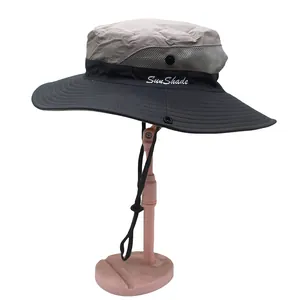 Detail of wide brim sun hat featuring breathable mesh panels and adjustable chin strap