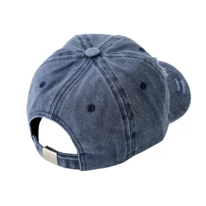 Detail of navy washed denim kids cap featuring adjustable silver metal buckle at the back