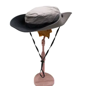 Detail of gray sun hat with breathable mesh and black adjustable drawstring