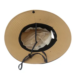 Detail view of khaki sun hat with breathable white mesh lining and adjustable wind rope