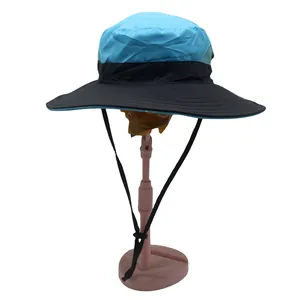 Detail of blue and black sun hat with adjustable windproof drawstring for outdoor use