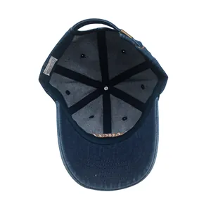 Internal detail of Los Angeles denim baseball cap showing stitching and metal buckle