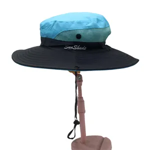 Detail showing breathable green mesh side panels and SunShade embroidery on a blue sun hat