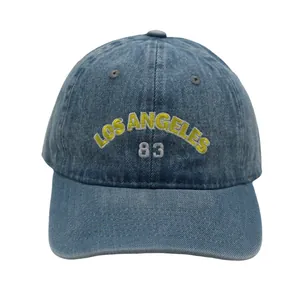 Washed blue denim baseball cap featuring yellow embroidered Los Angeles 83 lettering
