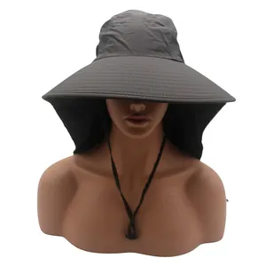 Detail of dark grey sun hat featuring wide brim, neck flap, and adjustable windproof cord