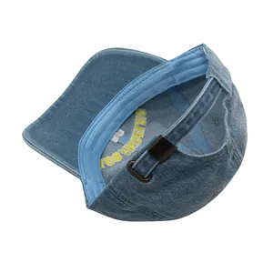 Detail view of the LOS ANGELES embroidery and adjustable metal buckle on denim cap